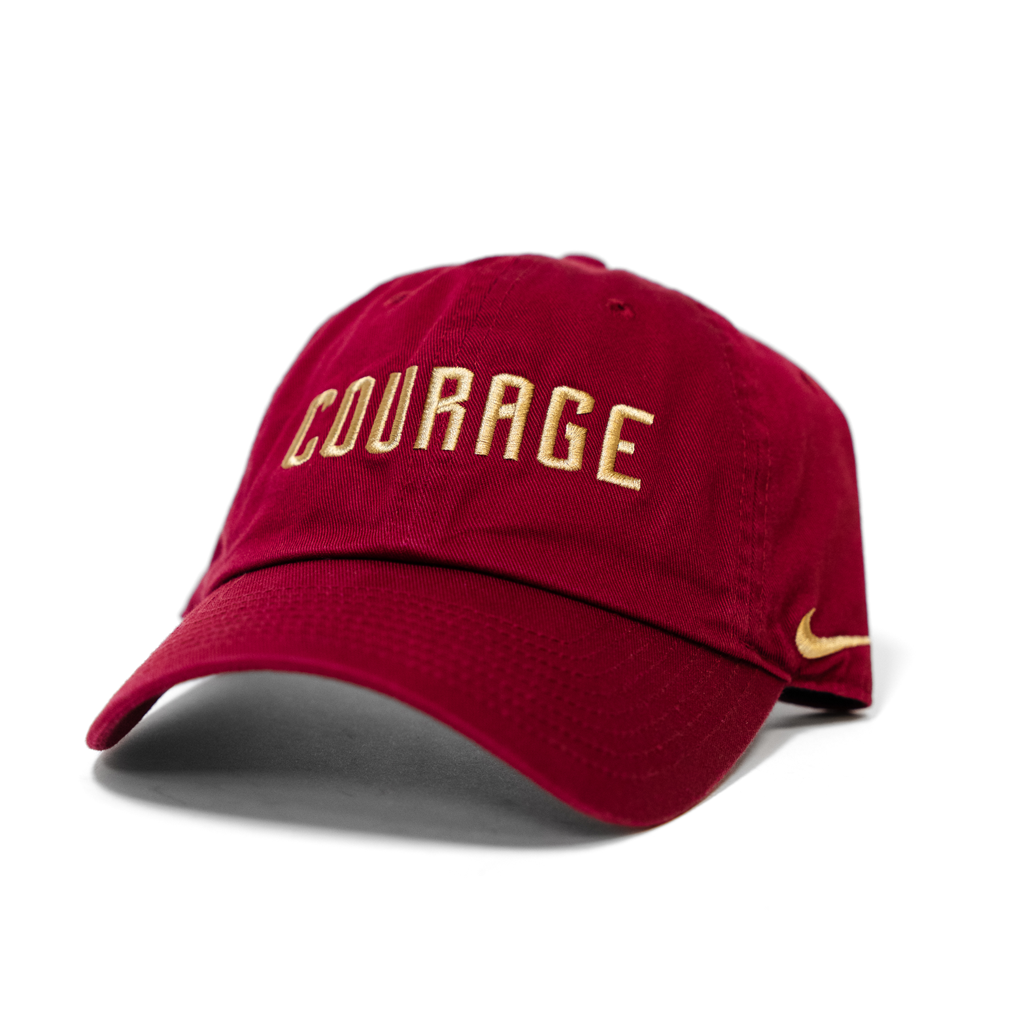 Red cap with 'Courage' in gold on a white background
