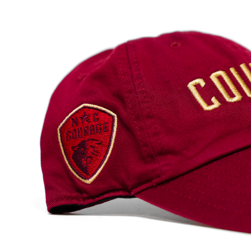 Red cap with embroidered North Carolina Courage logo and text on a white background