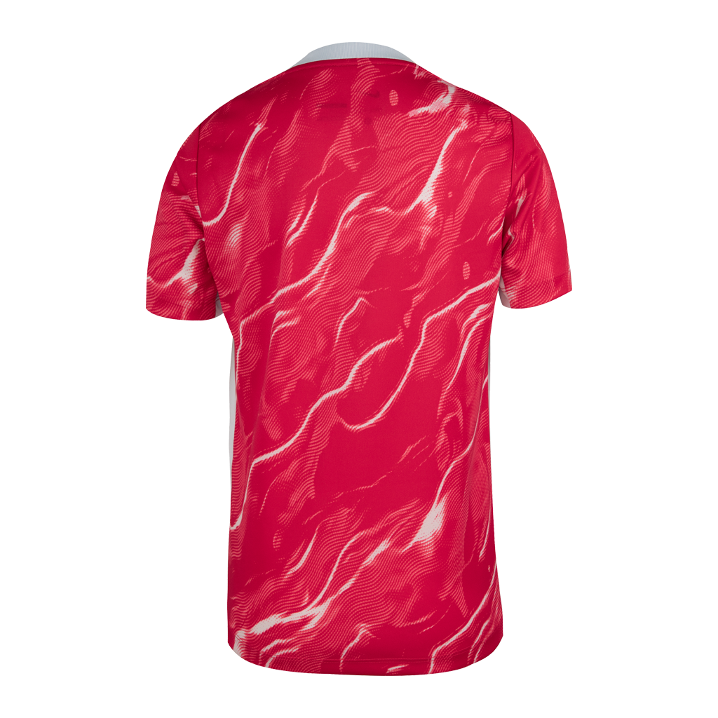 Youth fit pink Nike pre-match jersey featuring the NC Courage crest and a pink patterned design.