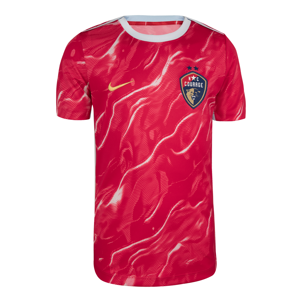 Youth fit pink Nike pre-match jersey featuring the NC Courage crest and a pink patterned design.