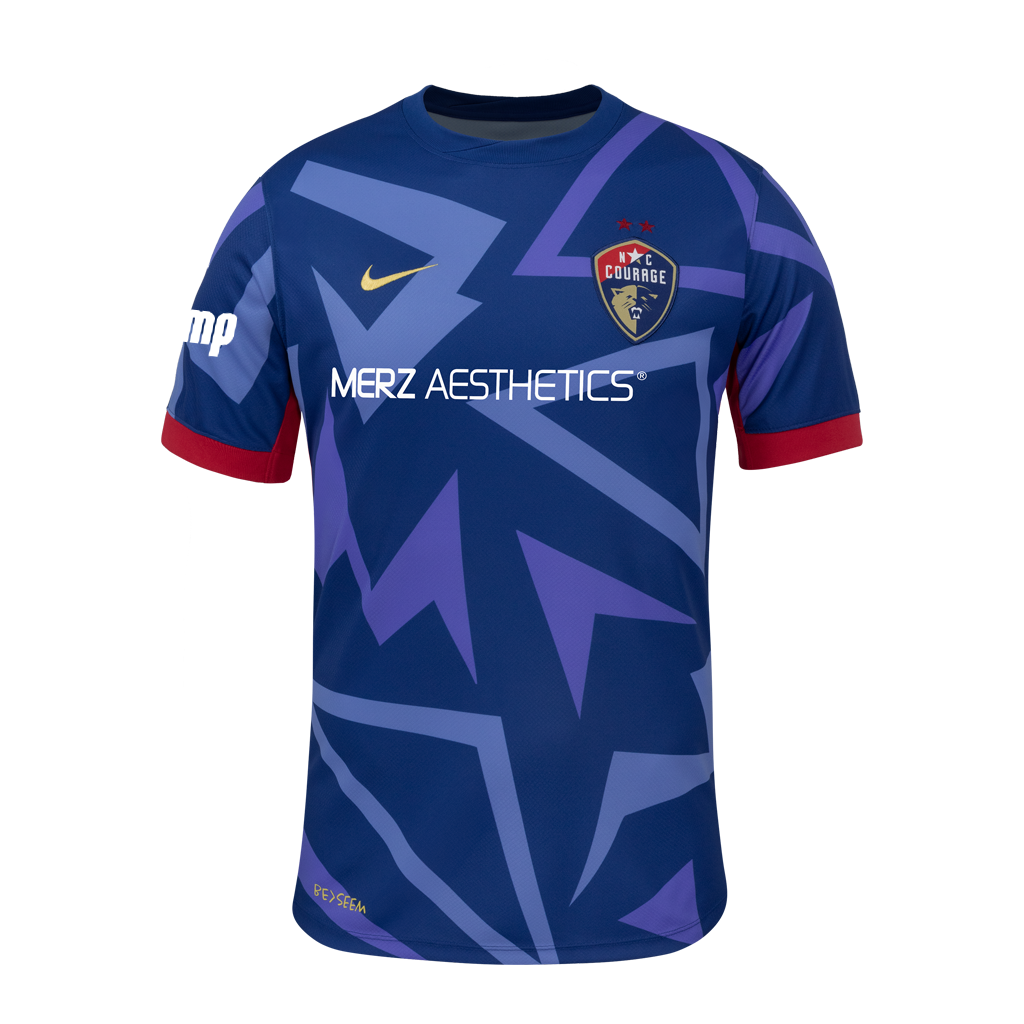 2025 Blue "The Belong" regular fit Kit with blue triangle designs, red rims on sleeve, NC Courage Logo and gold Nike logo, and Merz logo.