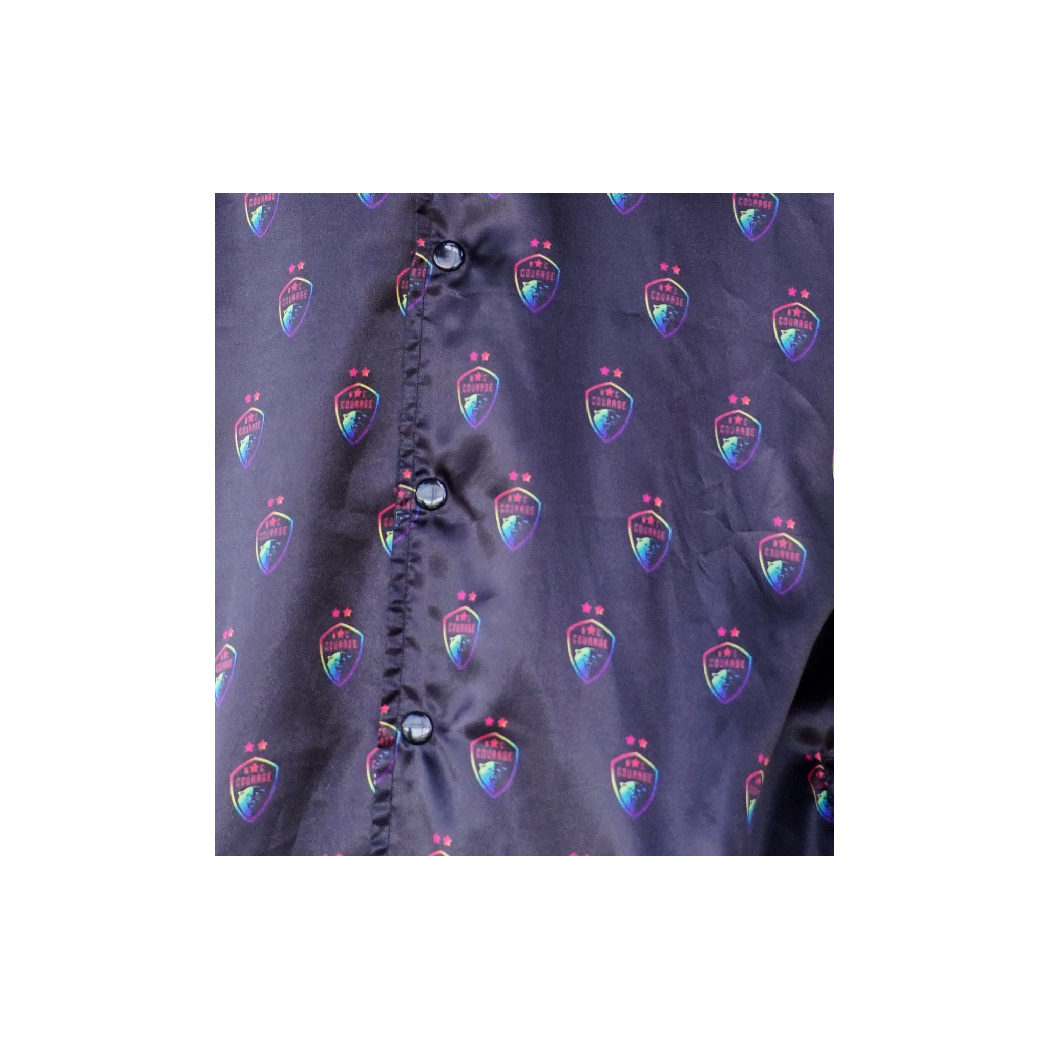 A closeup of the Pride Courage logo on the Black Satin Jacket.