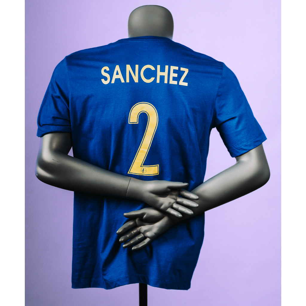 A blue Nike jersey tee on a mannequin featuring the number 2 and the name 'SANCHEZ' on the back.