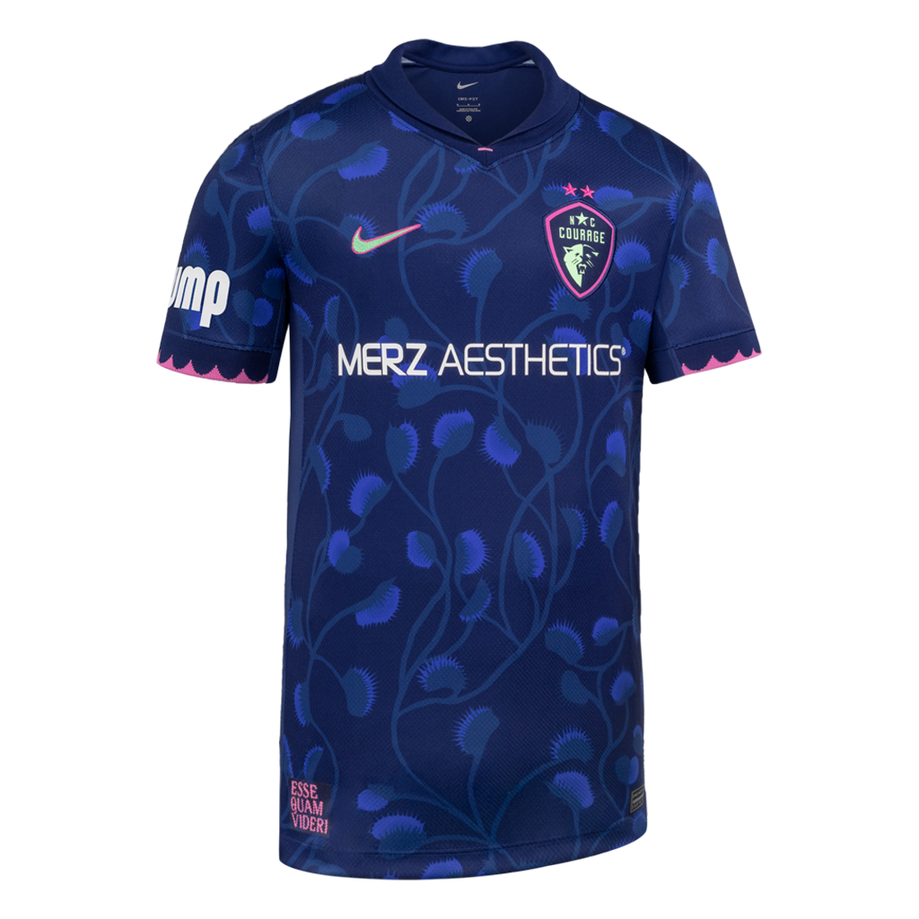 Blue sports jersey with branding and venus flytrap patterns on a white background