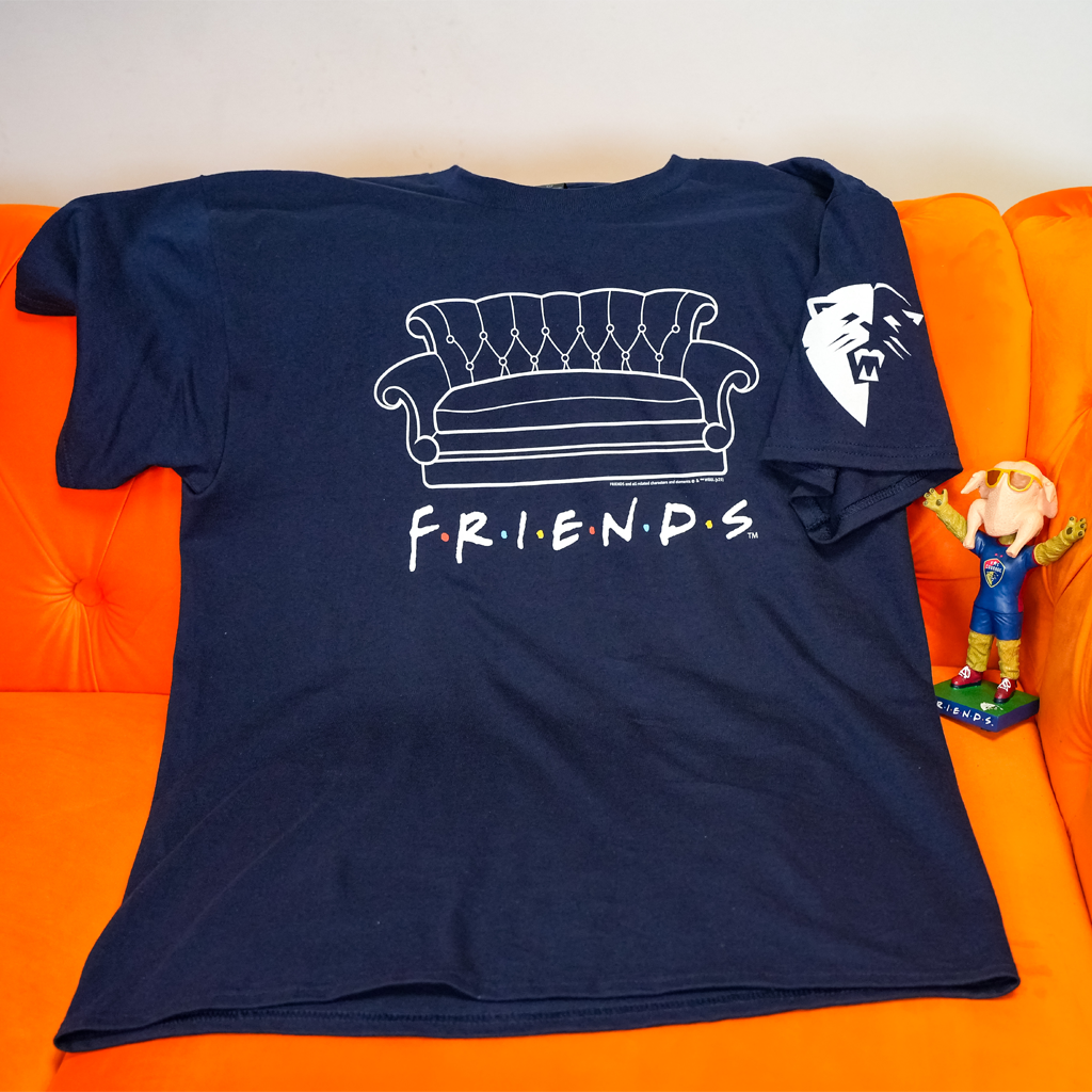 Navy blue t-shirt with 'Friends' logo on an orange couch