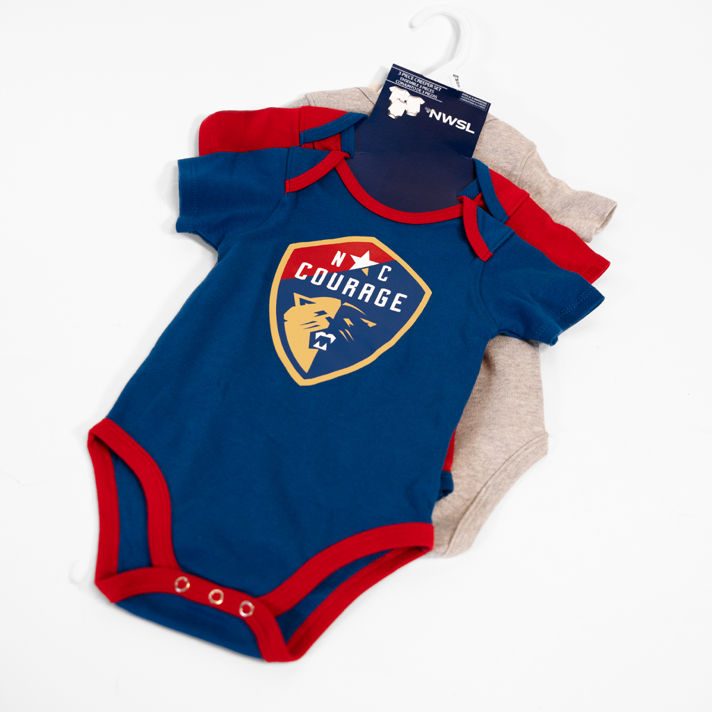Blue baby onesie with red trim and 'NC Courage' logo on a white background