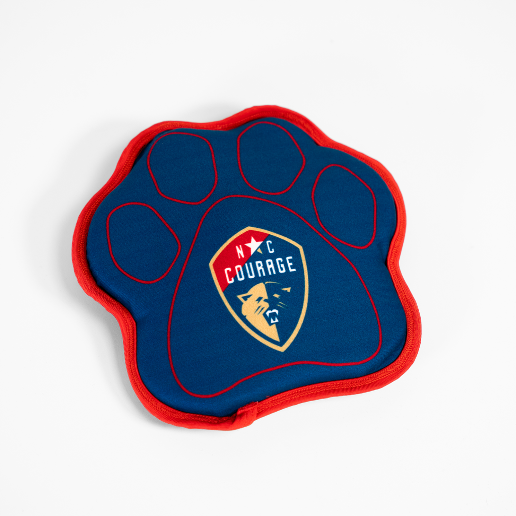 A blue and red dog paw-shaped toy with the 'NC Courage' logo in the center.