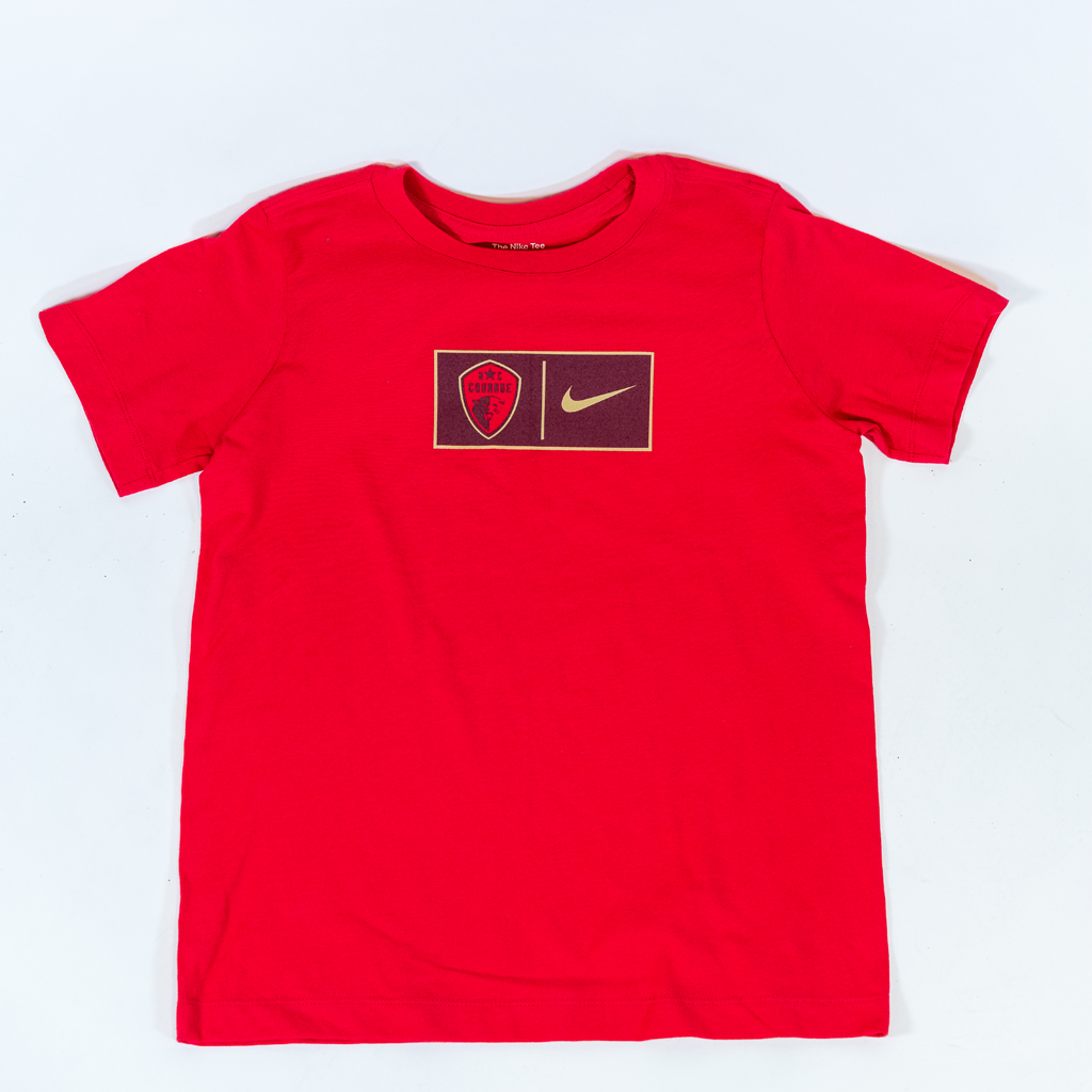 A pink youth T-shirt with the North Carolina Courage logo and a Nike swoosh in the center.