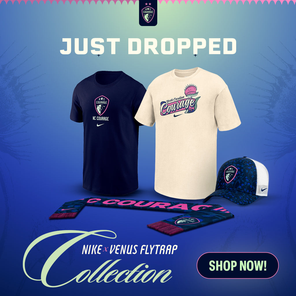 Nike x Venus Flytrap collection promotional graphic showing a navy and cream t-shirt set, a matching cap, and a scarf with the text 'COURAGE' on a blue gradient background with 'JUST DROPPED' and 'SHOP NOW!' text.