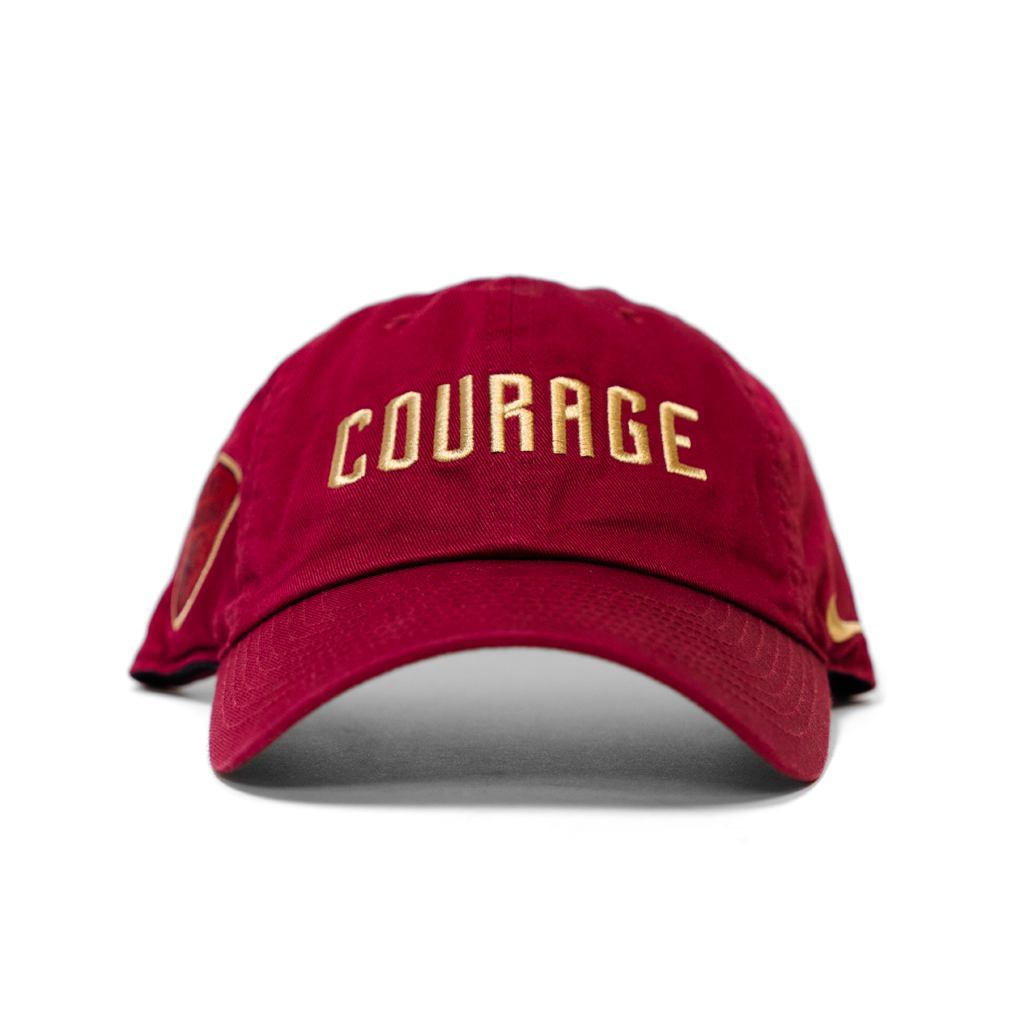 Red cap with 'Courage' in gold on a white background