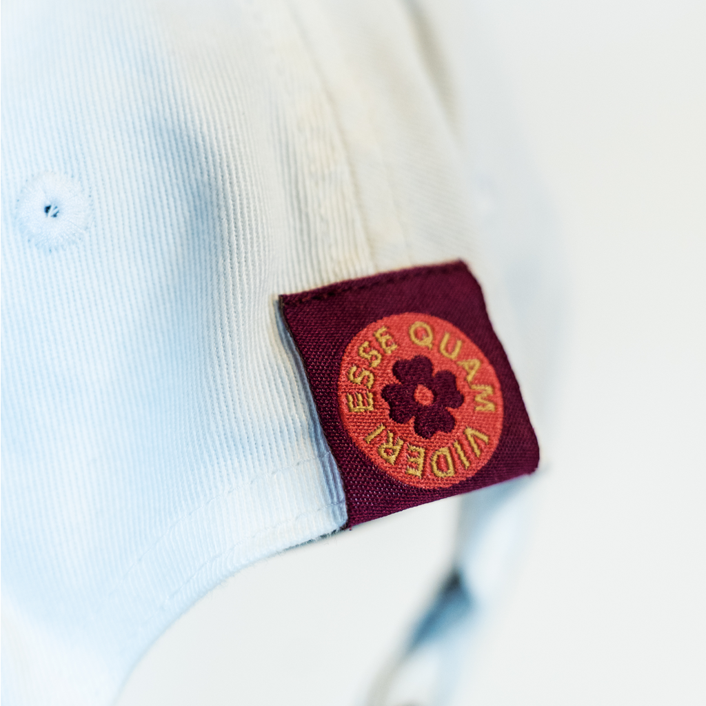 Tag that says "ESSE QUAM VIDERI' 