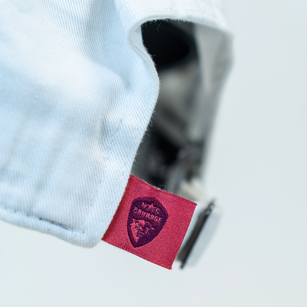 Closeup of pink NC Courage tag