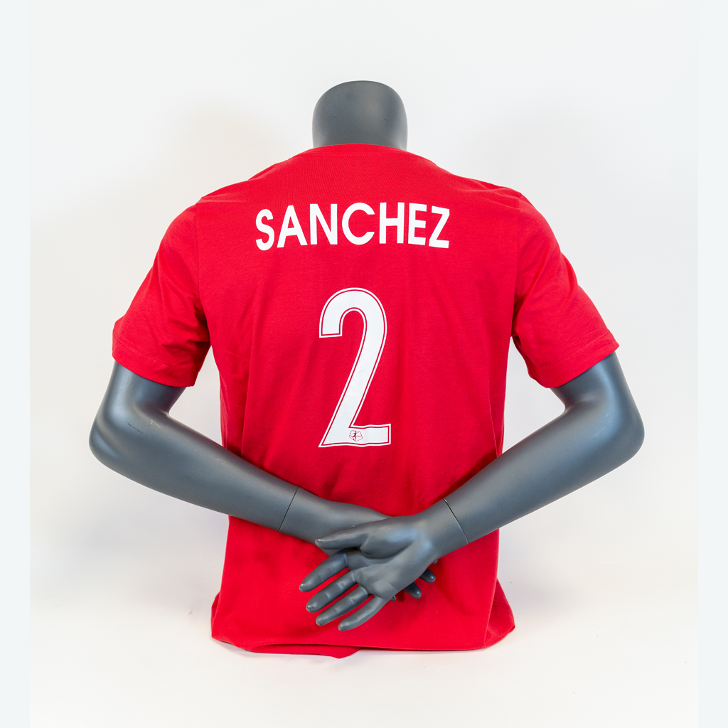 A pink t-shirt soccer jersey with the name 'SANCHEZ' and the number '2' printed on the back, displayed on a mannequin.