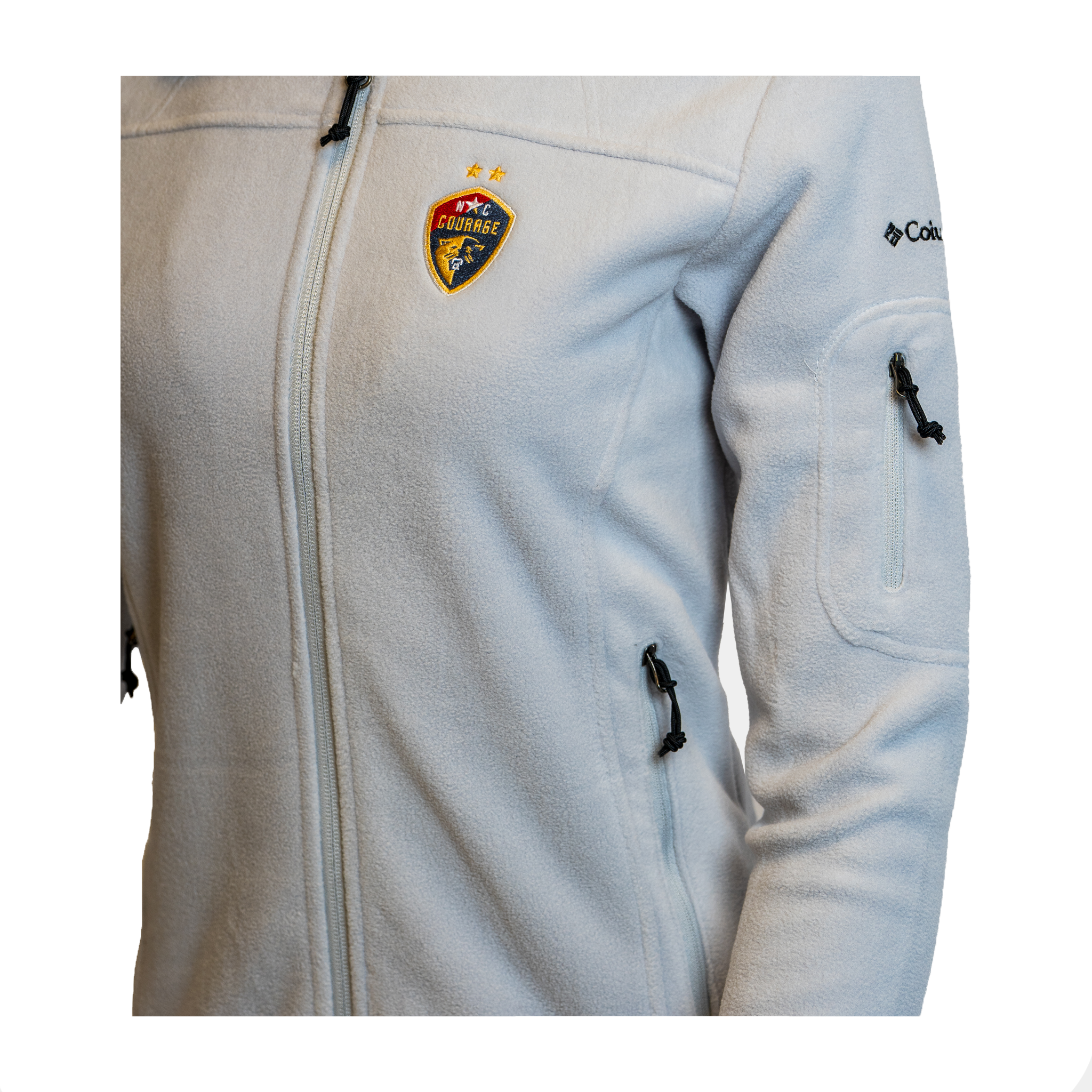 A close up of a grey fleece full zip jacket with a logo on the left chest area, displayed on a mannequin.