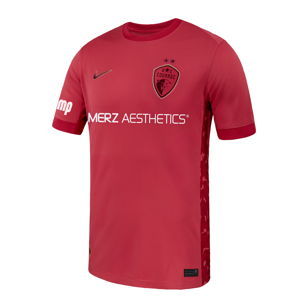 Pink sports jersey with Nike logo and 'Merz Aesthetics' branding on a white background