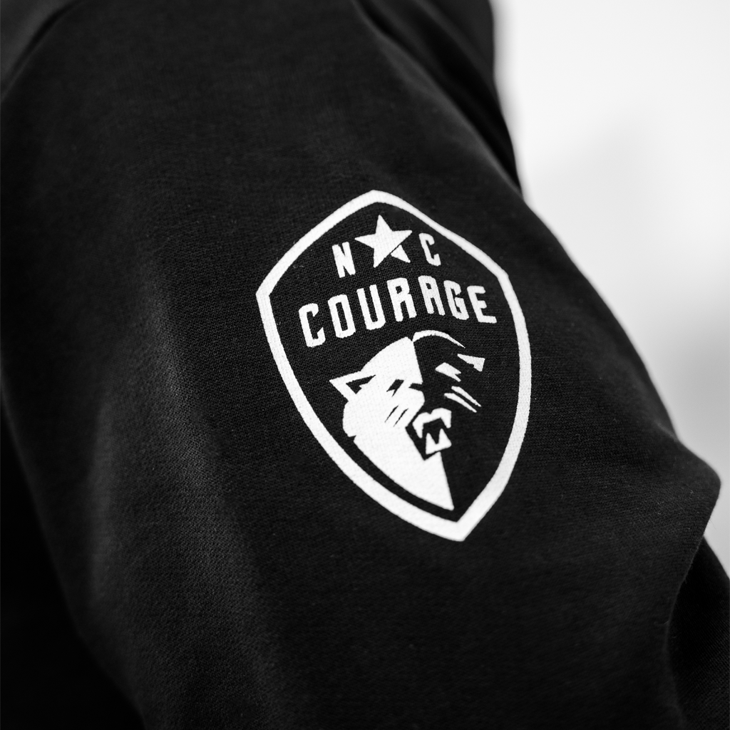 Black sweatshirt with a white logo on the sleeve