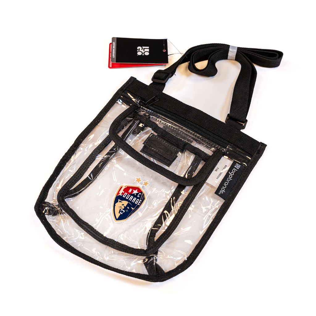 Clear crossbody bag with black strap and the North Carolina Courage logo on the pocket laid on a white background