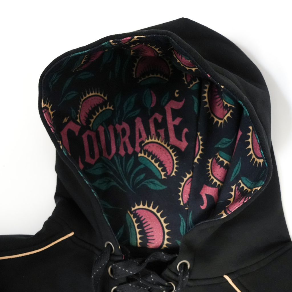 Black hoodie with 'Courage' design on a white background