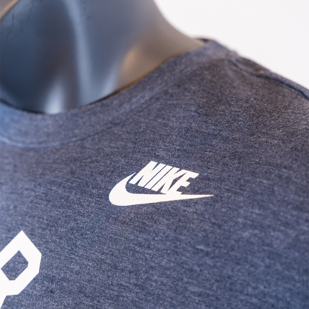 Close-up of a dark blue Nike t-shirt on a mannequin