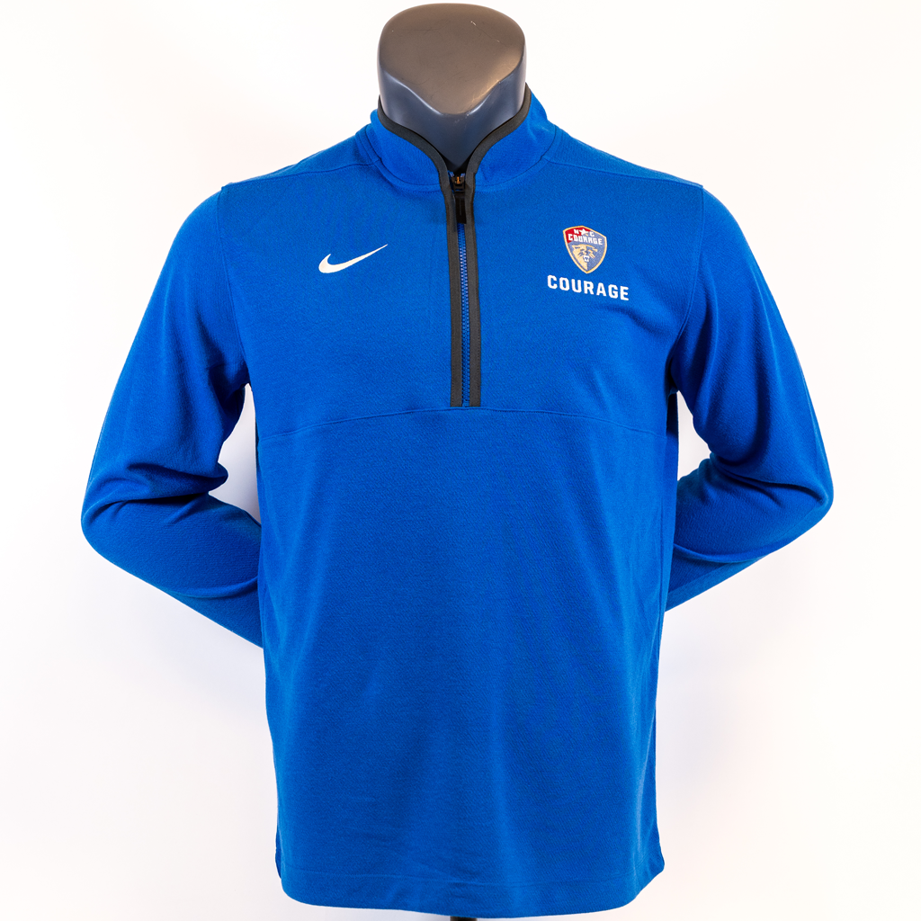 Blue pullover with Nike logo on the left and a North Carolina Courage logo on the right a mannequin against a white background