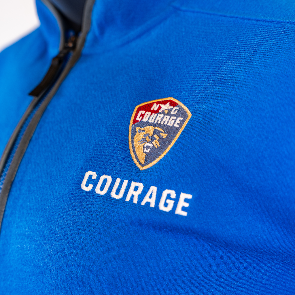 Blue jacket with 'Courage' logo and text on a white background